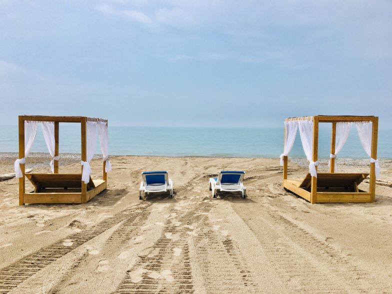 Enjoy your own private beach access with cabanas